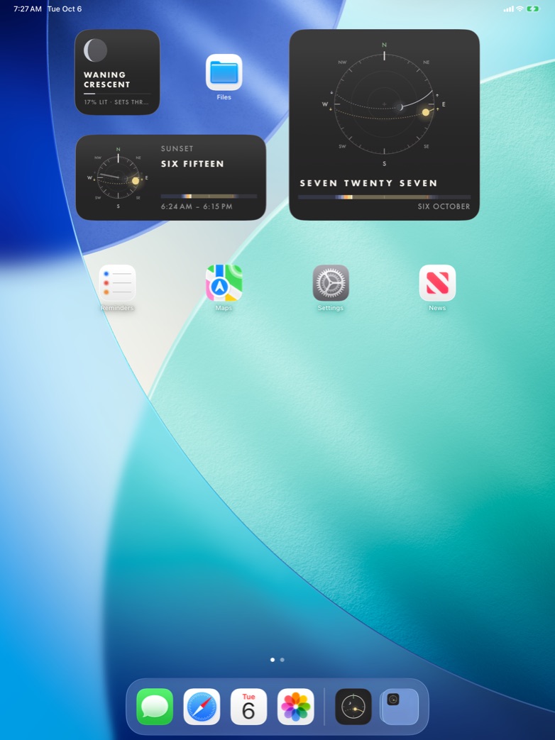 The Moon, Sun, and Sky dial widgets on the iPad Home Screen, with the time spelled out